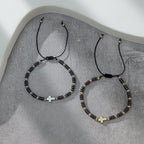Pulsera apilable de hematita con abalorios y 2 cruces
