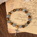 Pulsera Ojo de Tigre con Símbolo de San Benito: Una Fusión de Fe y Belleza