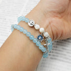 Pulsera Minimalista con Cuentas Azul Claro de 6 mm, Medalla Milagrosa y Crucifijo: Un Símbolo de Fe
