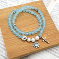 Pulsera Minimalista con Cuentas Azul Claro de 6 mm, Medalla Milagrosa y Crucifijo: Un Símbolo de Fe