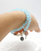 Pulsera Minimalista con Cuentas Azul Claro de 6 mm, Medalla Milagrosa y Crucifijo: Un Símbolo de Fe