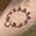 Pulsera de Cuarzo Rosa hecha a mano con camafeo de Nácar de la Virgen María