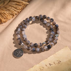 Pulsera Rosario de Cuentas Degrafiladas en Gris y Negro con San Benito: Escudo de Fe