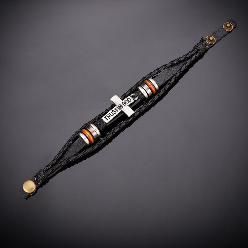Pulsera de cuero trenzado negro con cruz e inscripción CONFIANZA EN DIOS
