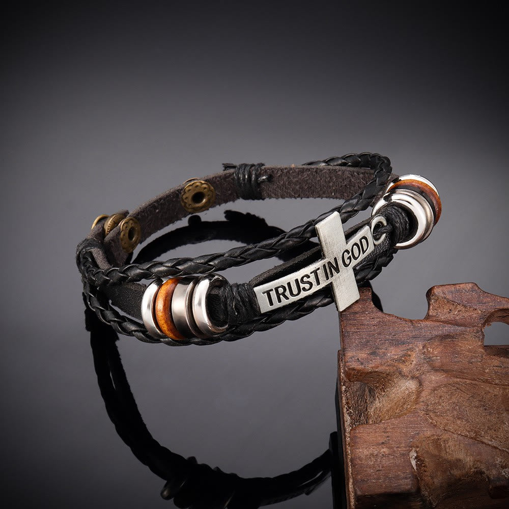 Pulsera de cuero trenzado negro con cruz e inscripción CONFIANZA EN DIOS