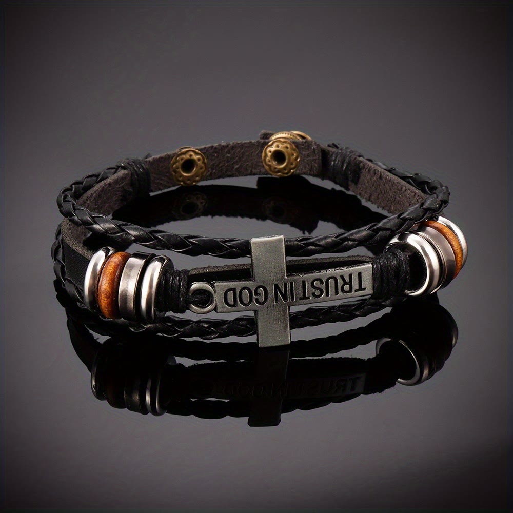 Pulsera de cuero trenzado negro con cruz e inscripción CONFIANZA EN DIOS