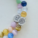 Pulsera de rosario de alambre de memoria de ojo de gato multicolor de 6 mm con detalles de San Benito