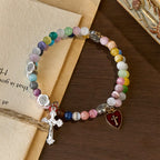 Pulsera de rosario de alambre de memoria de ojo de gato multicolor de 6 mm con detalles de San Benito