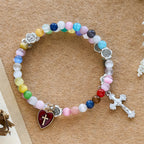 Pulsera de rosario de alambre de memoria de ojo de gato multicolor de 6 mm con detalles de San Benito