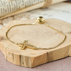 Pulsera con Cruz de Zirconia Dorada/Plateada/Negra: Encarna la Gracia de la Cruz
