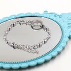 Mateo 17:20 y Lucas 1:37 con pulsera de semillas de mostaza: eslabones de corazón con detalle de puntos de circonita