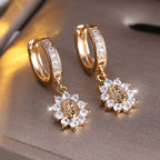 Our Lady Zircon Halo Huggie Earrings with Sunburst Medallion