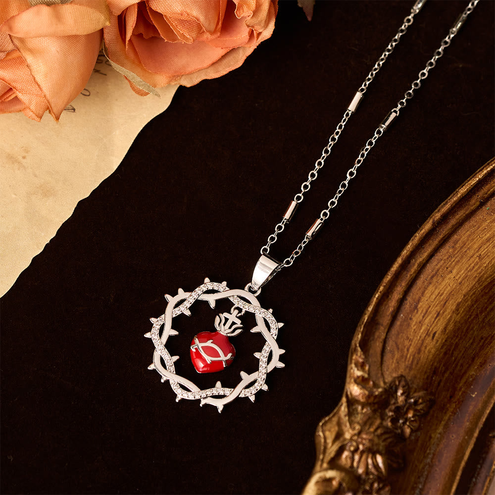 Collar bicolor con el Sagrado Corazón rodeado de espinas: Emblema del amor divino
