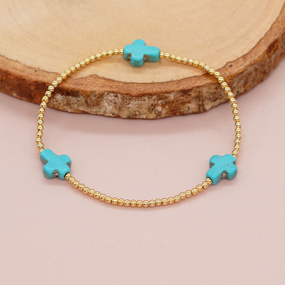 Pulsera de turquesas de diseño original con cuentas de cruz